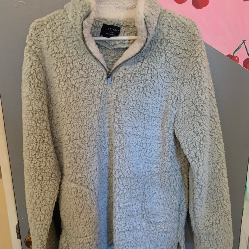 light green and white fuzzy sweater that is practically new, only worn once.